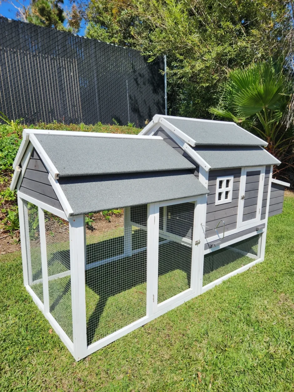 Small gray and white chicken coop